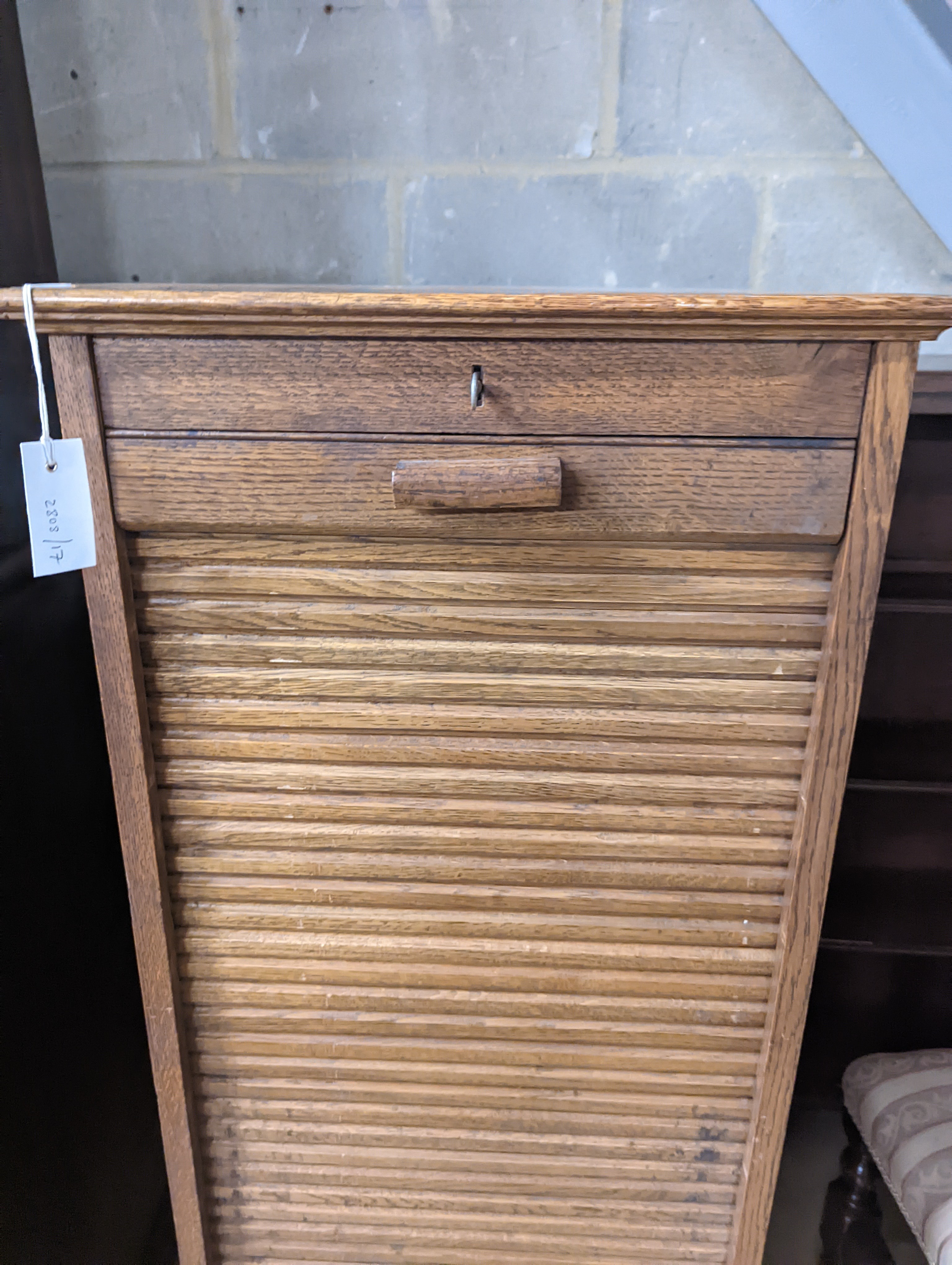 An early 20th century oak tambour filing cabinet, width 49cm, depth 40cm, height 125cm